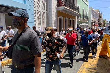 Correctional officers in Puerto Rico hold a rally to demand wage fairness