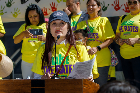 400 child care providers deliver roses and demand fair pay from governor