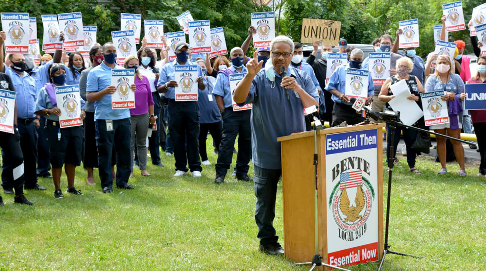 Rochester school employees rally against layoffs among essential workers